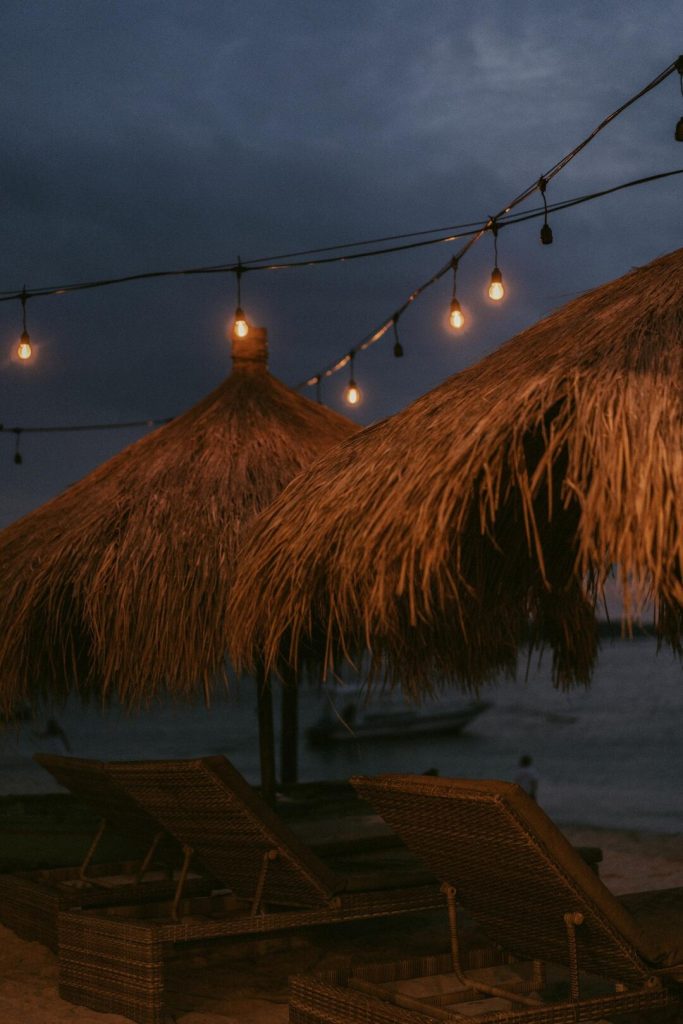 Tropical-Beach-Straw-Umbrellas-Vintage-Light-Bulbs-Tropical-Style-Mood_1321-3266 Licensed Electrician And Electrical Contractor In West Palm Beach, Florida|Boat & Beach Deck Lighting