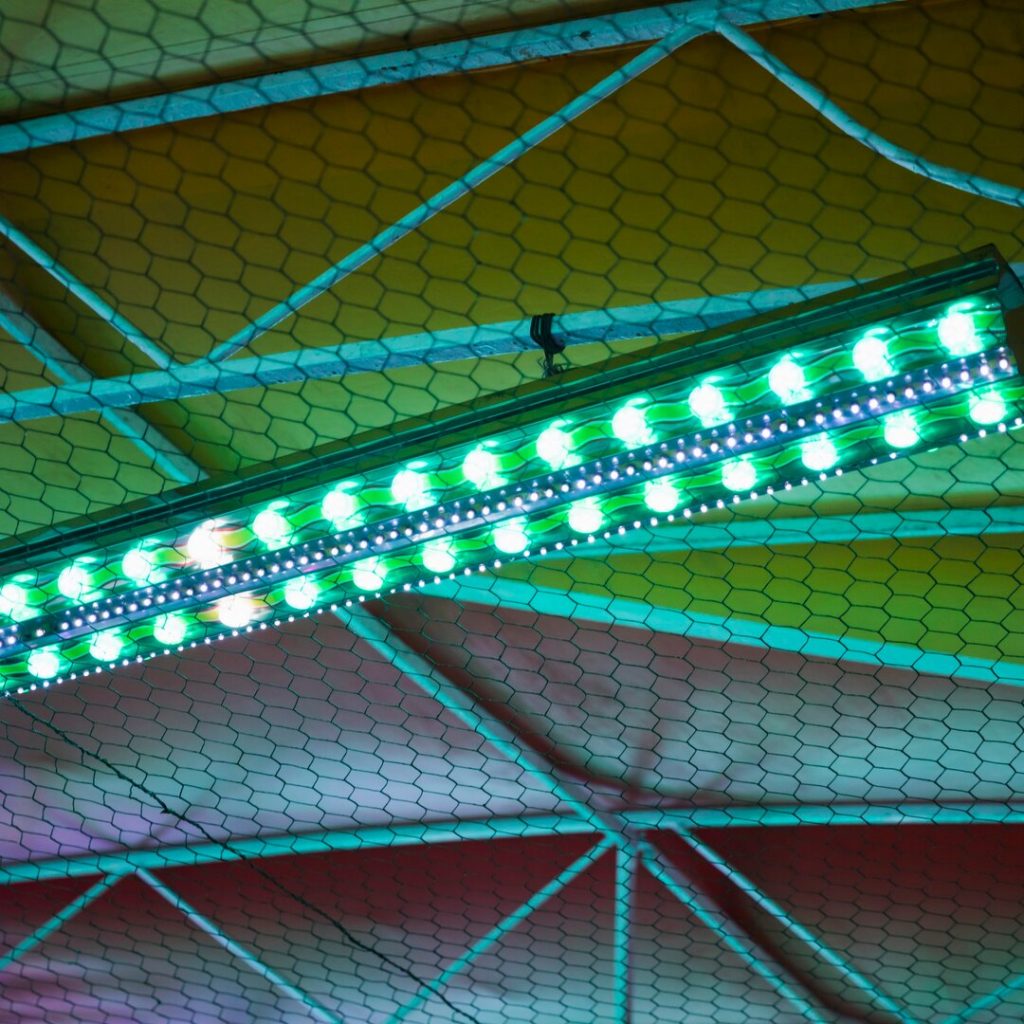 Funfair-Top-Night-With-Green-Blue-Lights_23-2148281654 Licensed Electrician And Electrical Contractor In West Palm Beach, Florida|Sports Fields Lighting